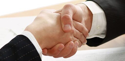 Handshake of business partners Handshake of business partners